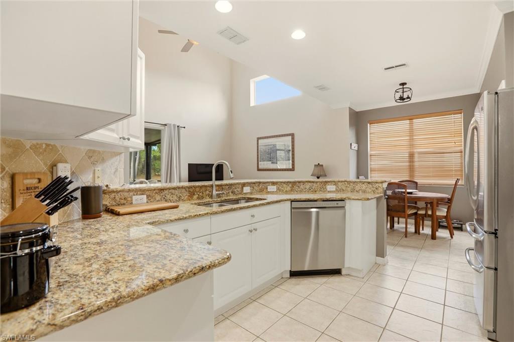 21524 Windham Run Estero, FL 33928 - Photo 19 of 50 a bathroom with a granite countertop sink and a mirror