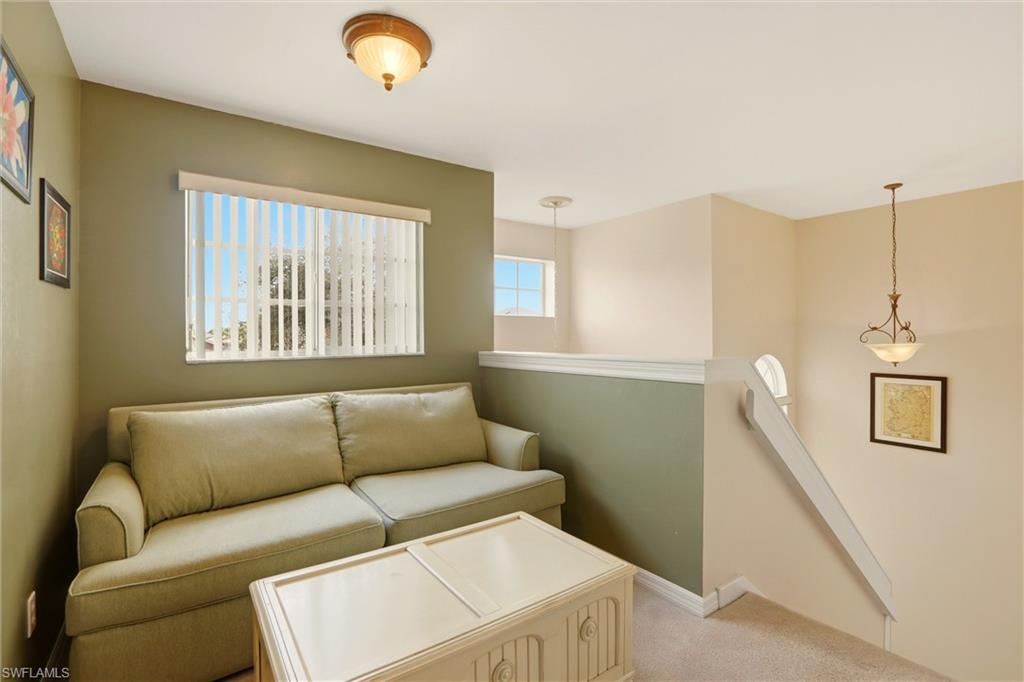 21524 Windham Run Estero, FL 33928 - Photo 24 of 50 a living room with furniture and a window