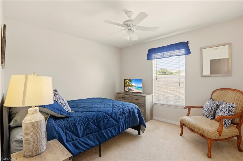 21524 Windham Run Estero, FL 33928 - Photo 27 of 50 a bedroom with furniture and a window