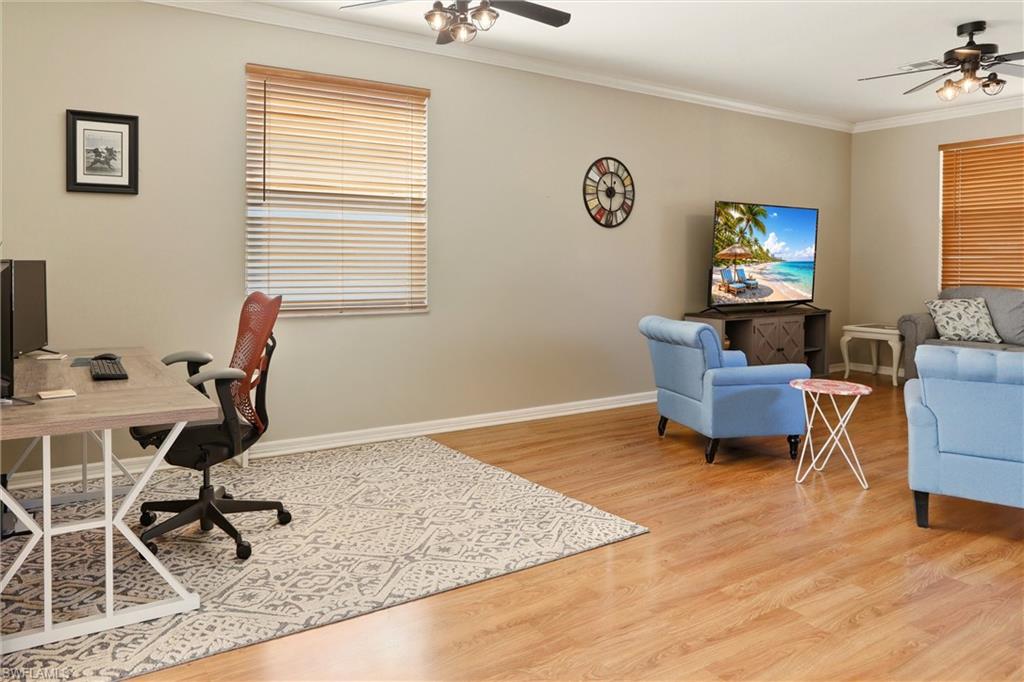 21524 Windham Run Estero, FL 33928 - Photo 4 of 50 a view of a workspace with furniture and a window