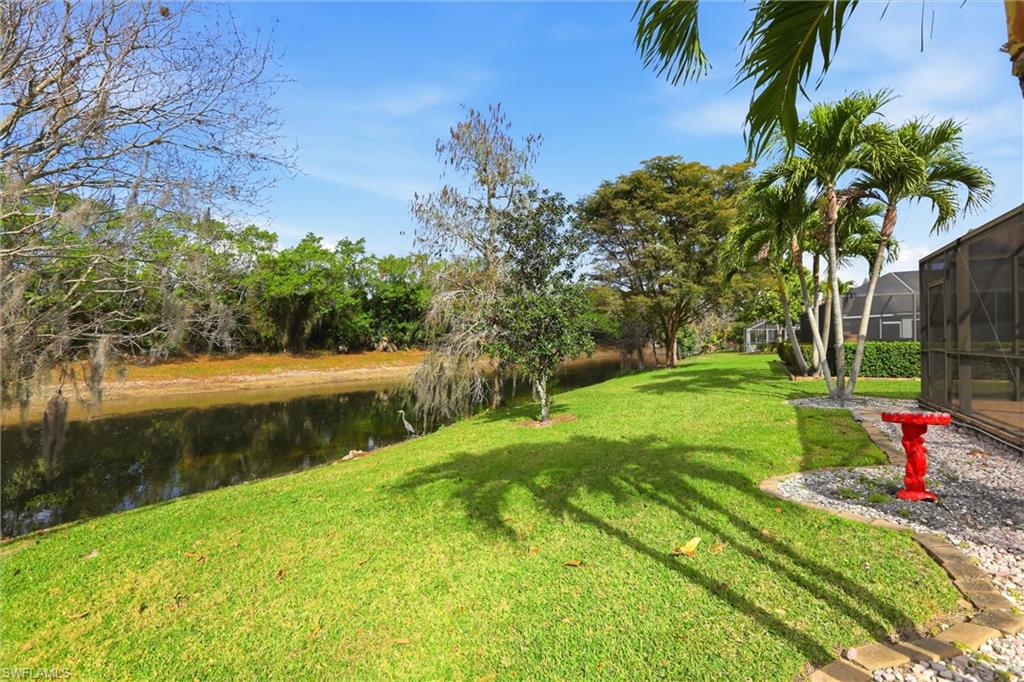 21524 Windham Run Estero, FL 33928 - Photo 42 of 50 a view of a garden with a lake view