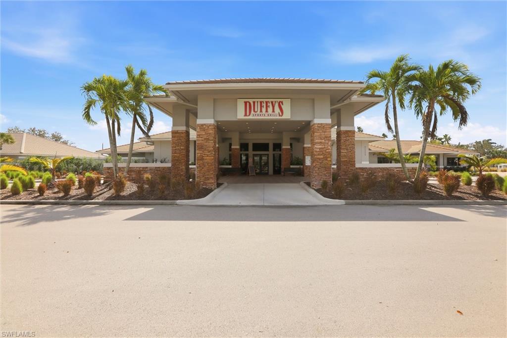 21524 Windham Run Estero, FL 33928 - Photo 46 of 50 a view of a building with palm trees