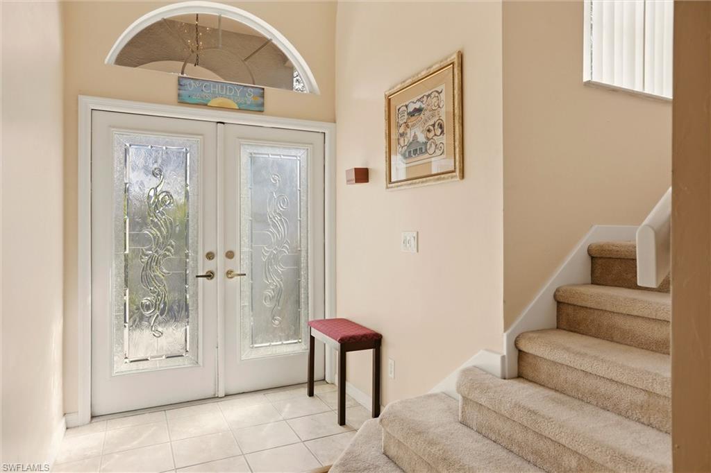 21524 Windham Run Estero, FL 33928 - Photo 5 of 50 a living room with furniture and a painting