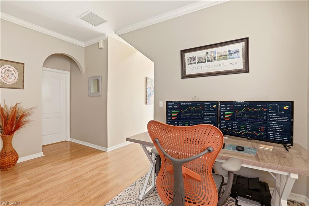 21524 Windham Run Estero, FL 33928 - Photo 6 of 50 a view of a workspace with furniture and wooden floor