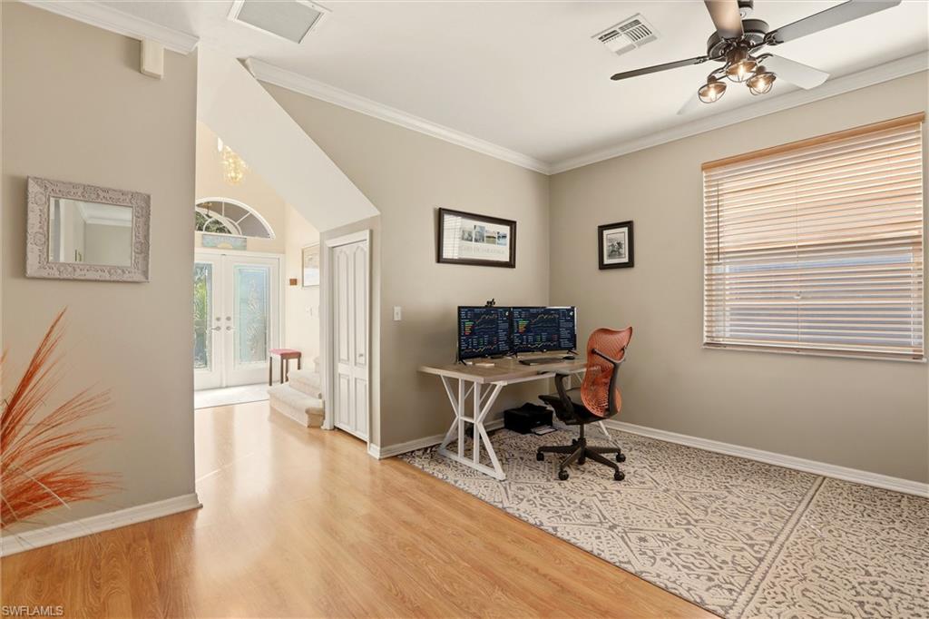 21524 Windham Run Estero, FL 33928 - Photo 7 of 50 a workspace with wooden floor and a window
