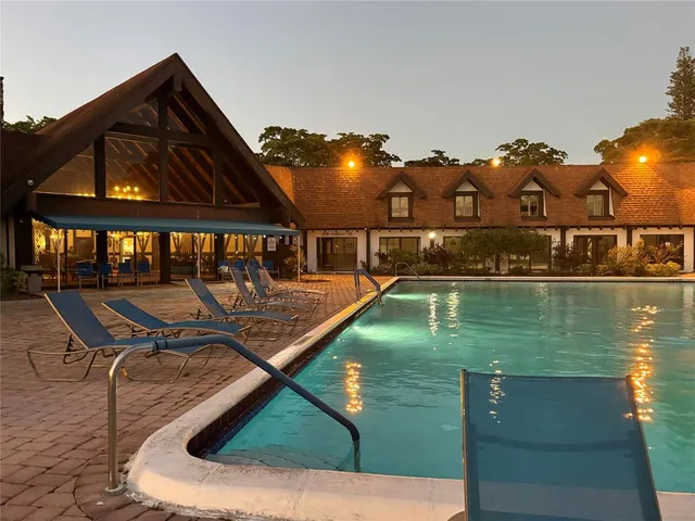 a view of a swimming pool with a patio