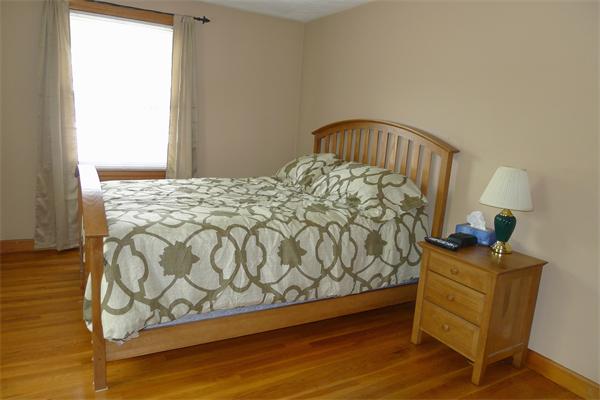 43 Boston Road Groton, MA 01450 - Photo 13 of 23 a bed sitting in a bedroom next to a window