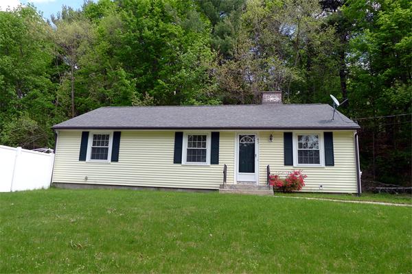 43 Boston Road Groton, MA 01450 - Photo 3 of 23 a front view of house with yard and green space