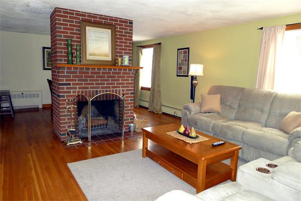43 Boston Road Groton, MA 01450 - Photo 4 of 23 a living room with furniture and a fireplace