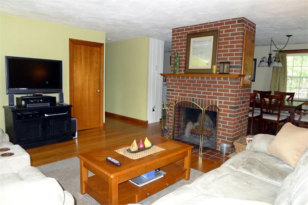 43 Boston Road Groton, MA 01450 - Photo 5 of 23 a living room with furniture and a flat screen tv