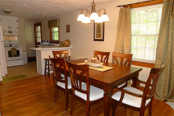 43 Boston Road Groton, MA 01450 - Photo 7 of 23 a view of a dining room with furniture and wooden floor