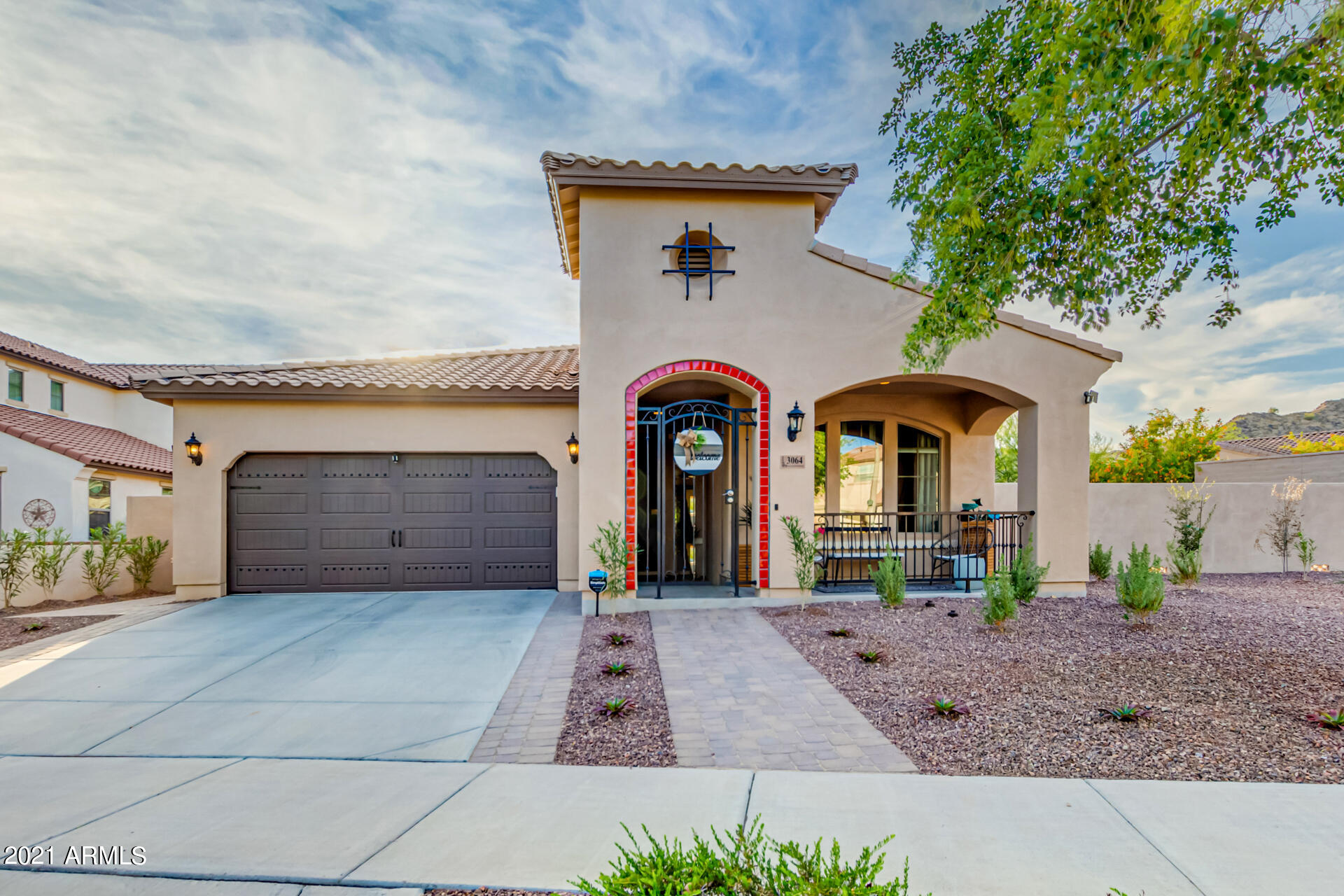 3064 North Point Ridge Road Buckeye, AZ 85396 - Photo 5 of 65 a front view of a house with garden