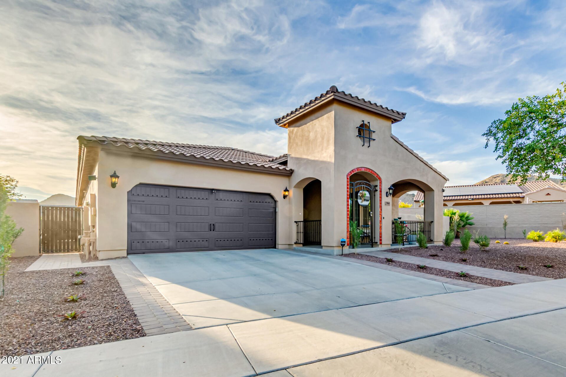 3064 North Point Ridge Road Buckeye, AZ 85396 - Photo 54 of 65 a front view of a house with yard and garage