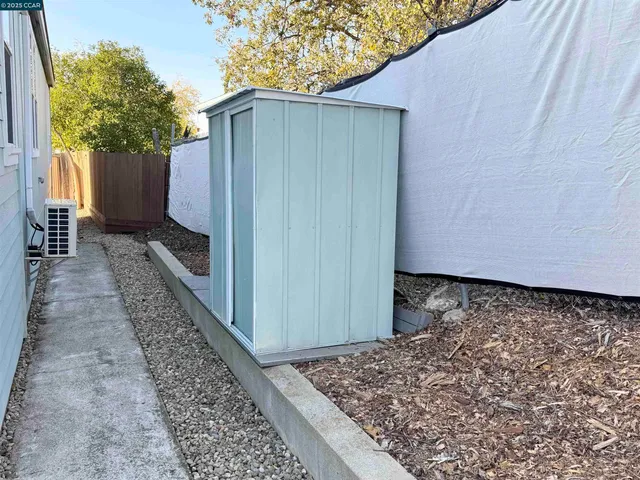 a view of a house with a small yard