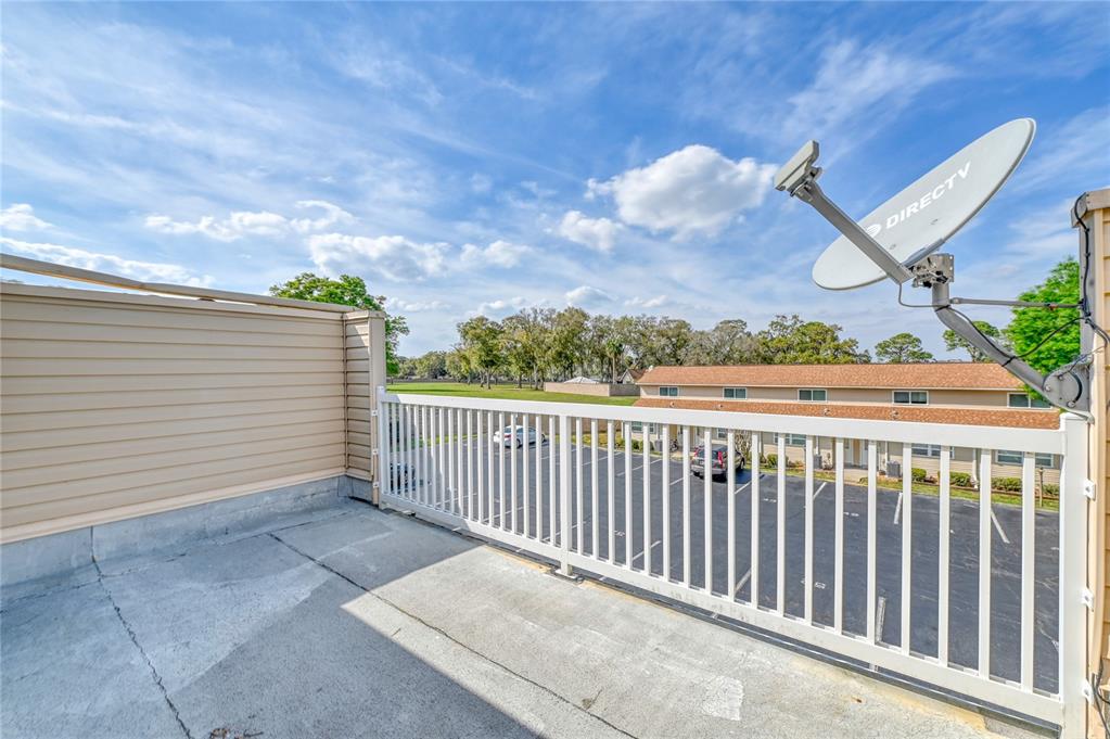 11001 Southeast Sunset Harbor Road, Unit H52 Summerfield, FL 34491 - Photo 5 of 31 a view of a balcony with an outdoor space