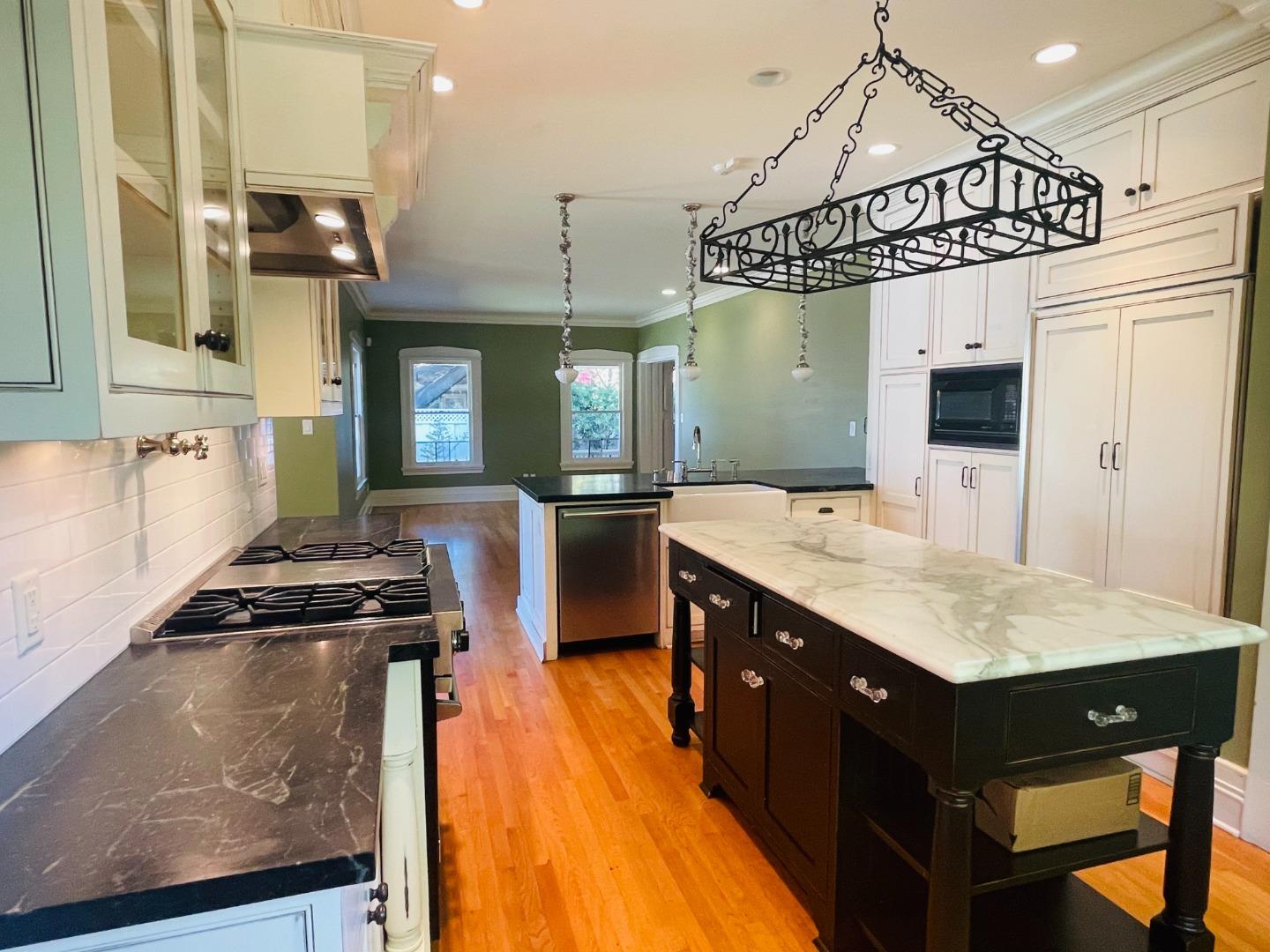 11995 Walbrook Drive Saratoga, CA 95070 - Photo 11 of 26 a kitchen with a sink stainless steel appliances a counter top space and cabinets