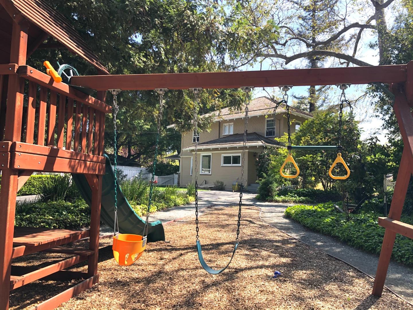 11995 Walbrook Drive Saratoga, CA 95070 - Photo 26 of 26 a view of a chair and tables in the backyard