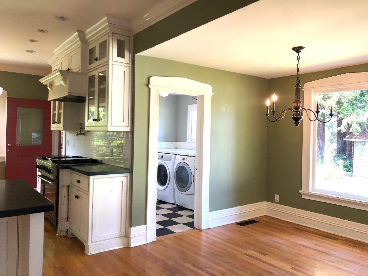 11995 Walbrook Drive Saratoga, CA 95070 - Photo 8 of 26 a kitchen with stainless steel appliances granite countertop a stove and a wooden floor