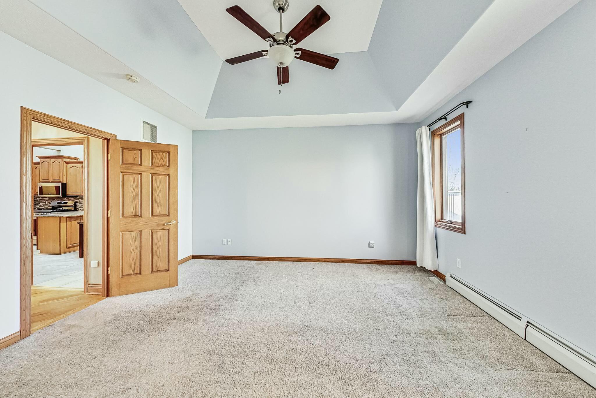 3519 Wicker Avenue Highland, IN 46322 - Photo 16 of 49 an empty room with windows and a ceiling fan
