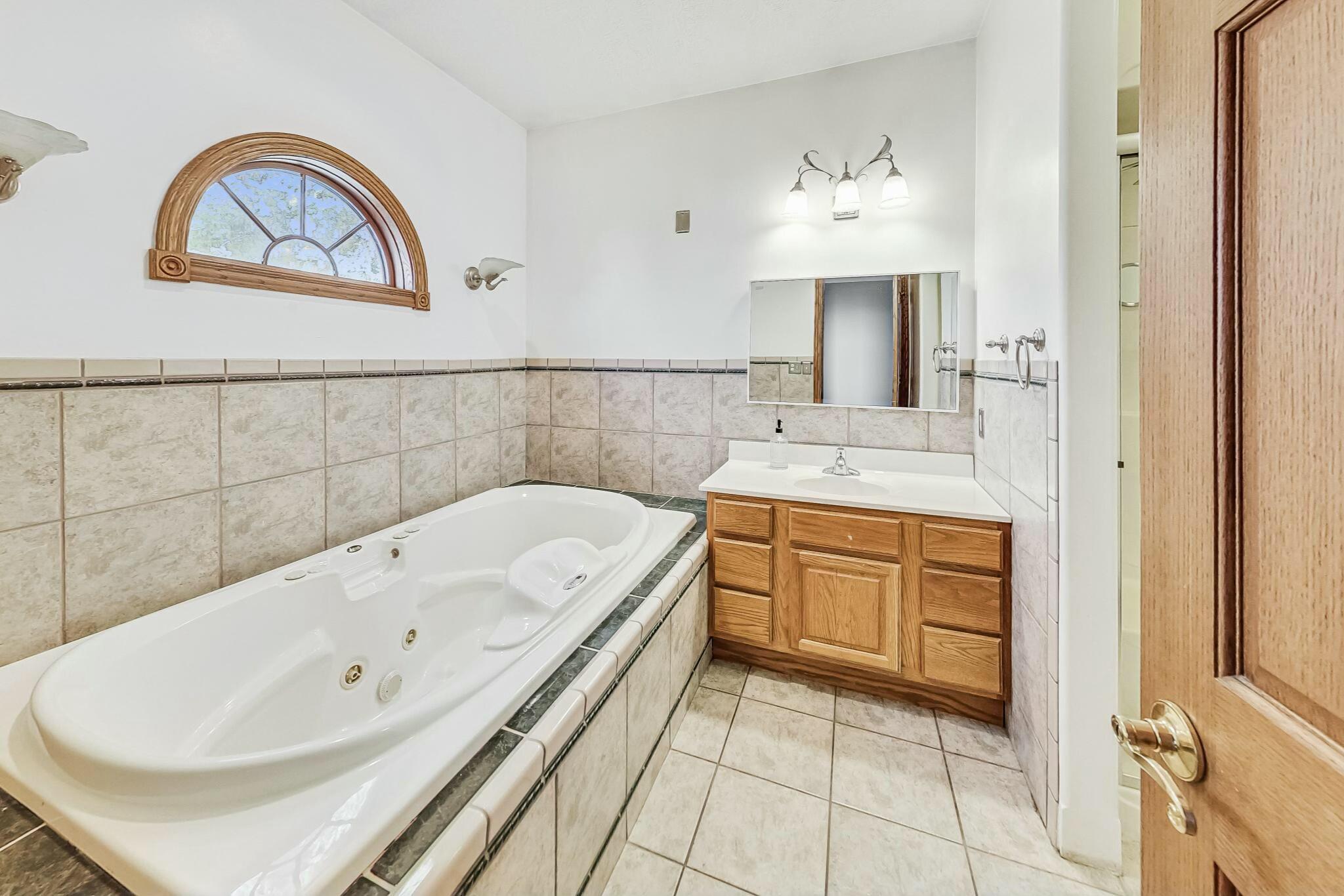 3519 Wicker Avenue Highland, IN 46322 - Photo 18 of 49 a bathroom with a sink and a bathtub