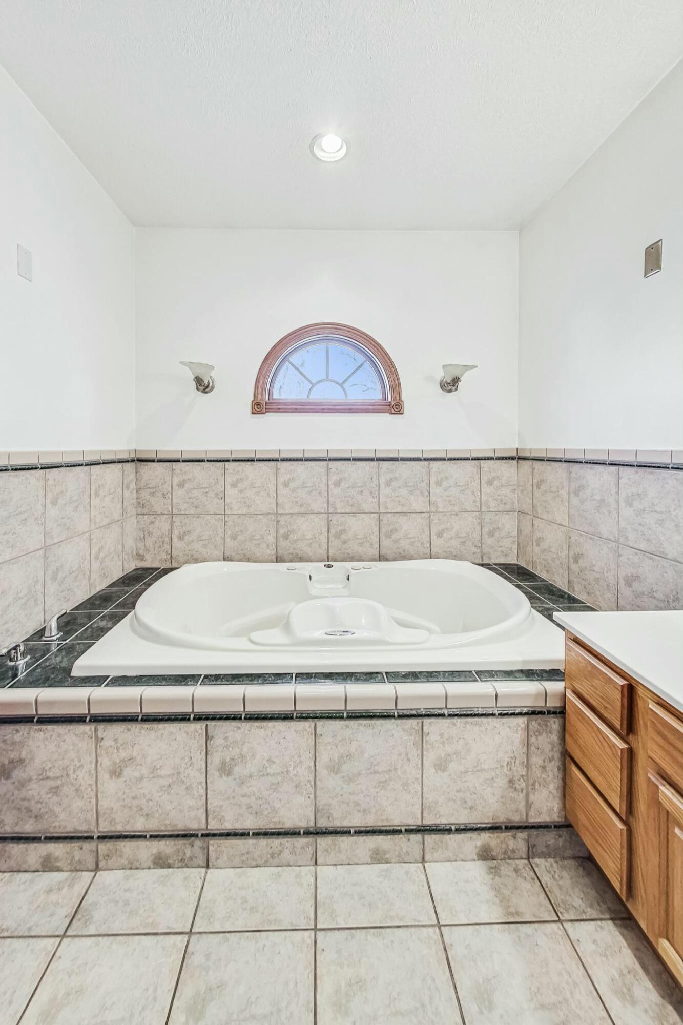 3519 Wicker Avenue Highland, IN 46322 - Photo 19 of 49 a bathroom with a bathtub and mirror