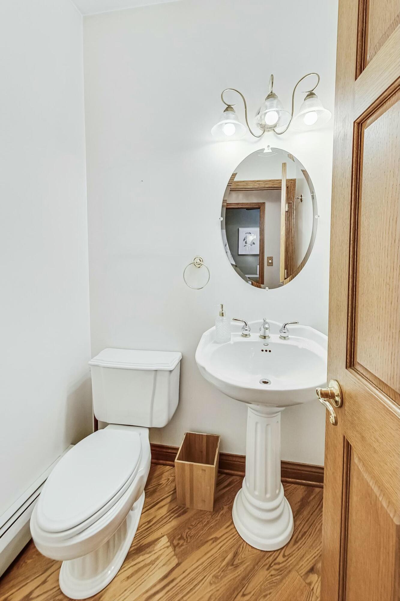 3519 Wicker Avenue Highland, IN 46322 - Photo 22 of 49 a bathroom with a toilet sink and mirror