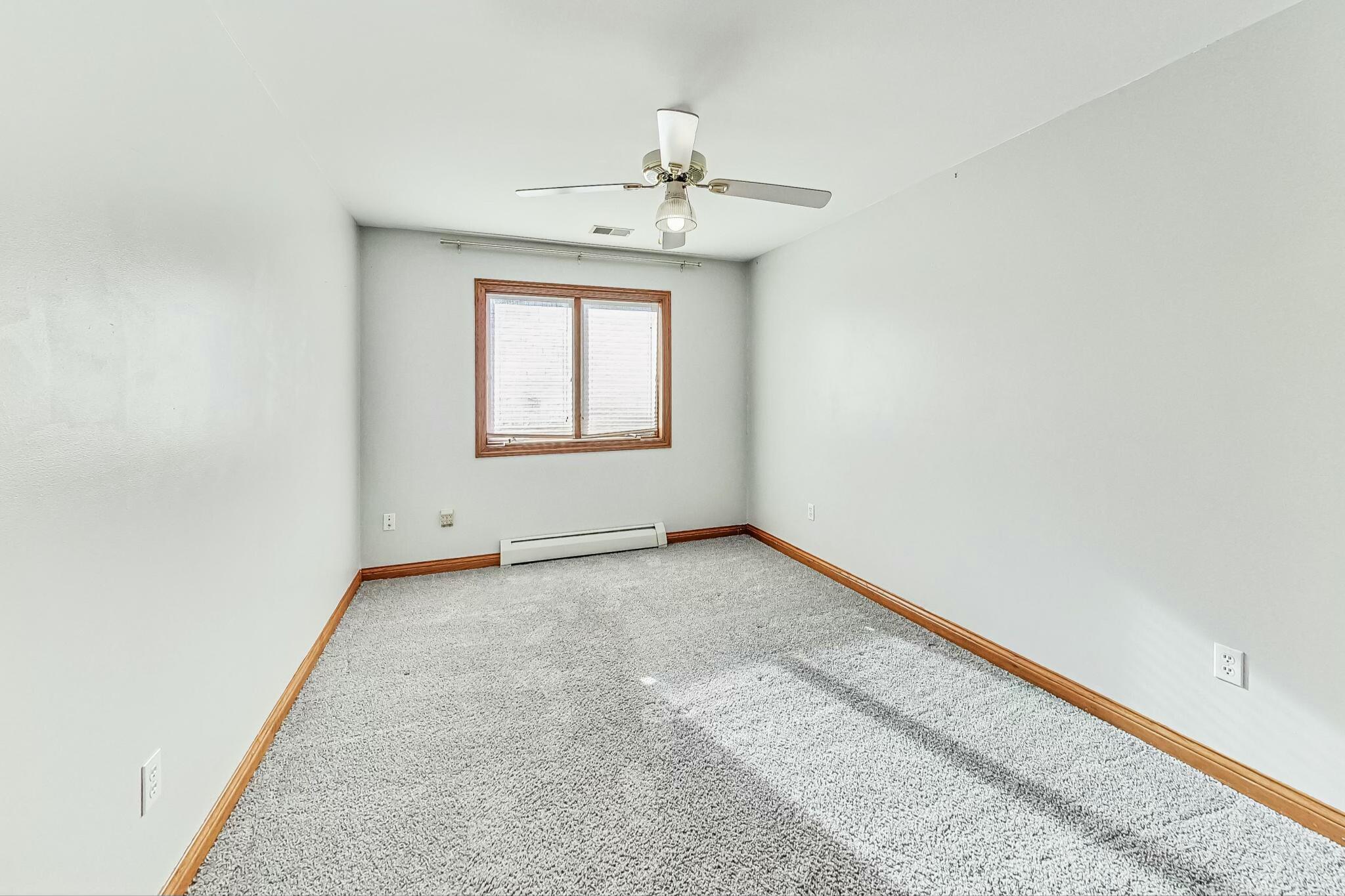 3519 Wicker Avenue Highland, IN 46322 - Photo 30 of 49 an empty room with a chandelier fan and windows
