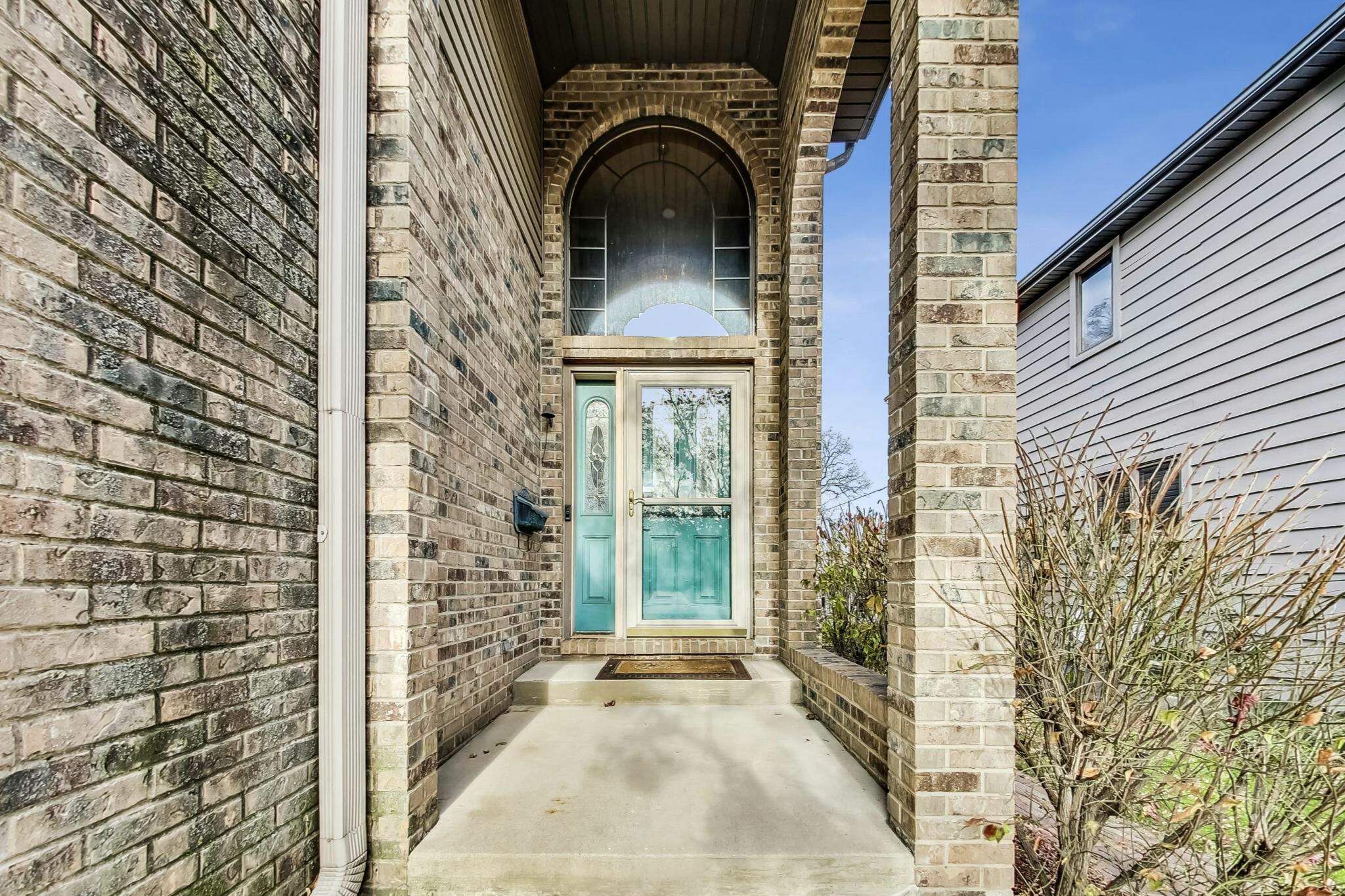 3519 Wicker Avenue Highland, IN 46322 - Photo 3 of 49 a view of a brick house with large windows