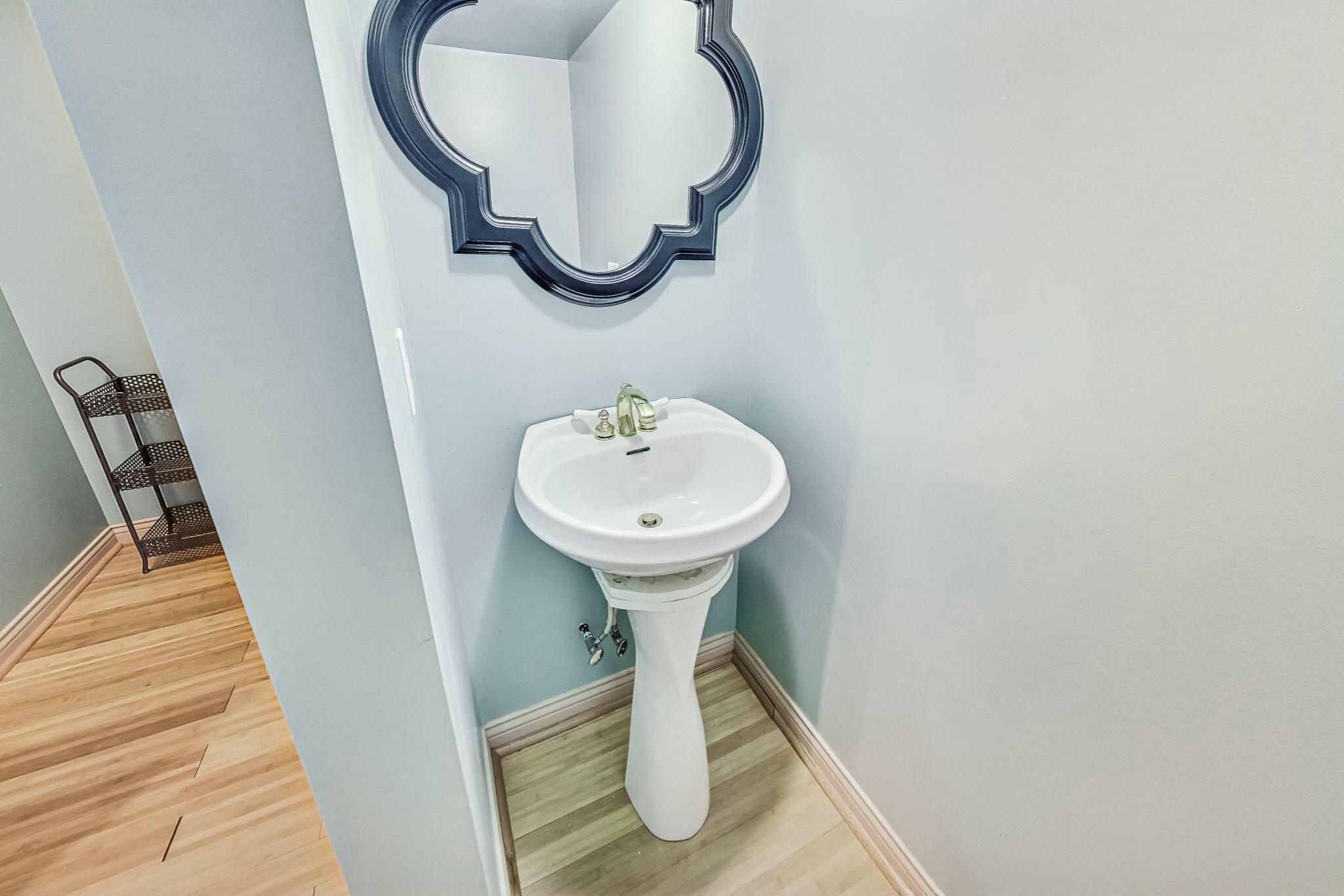 3519 Wicker Avenue Highland, IN 46322 - Photo 45 of 49 a bathroom with a sink and a mirror