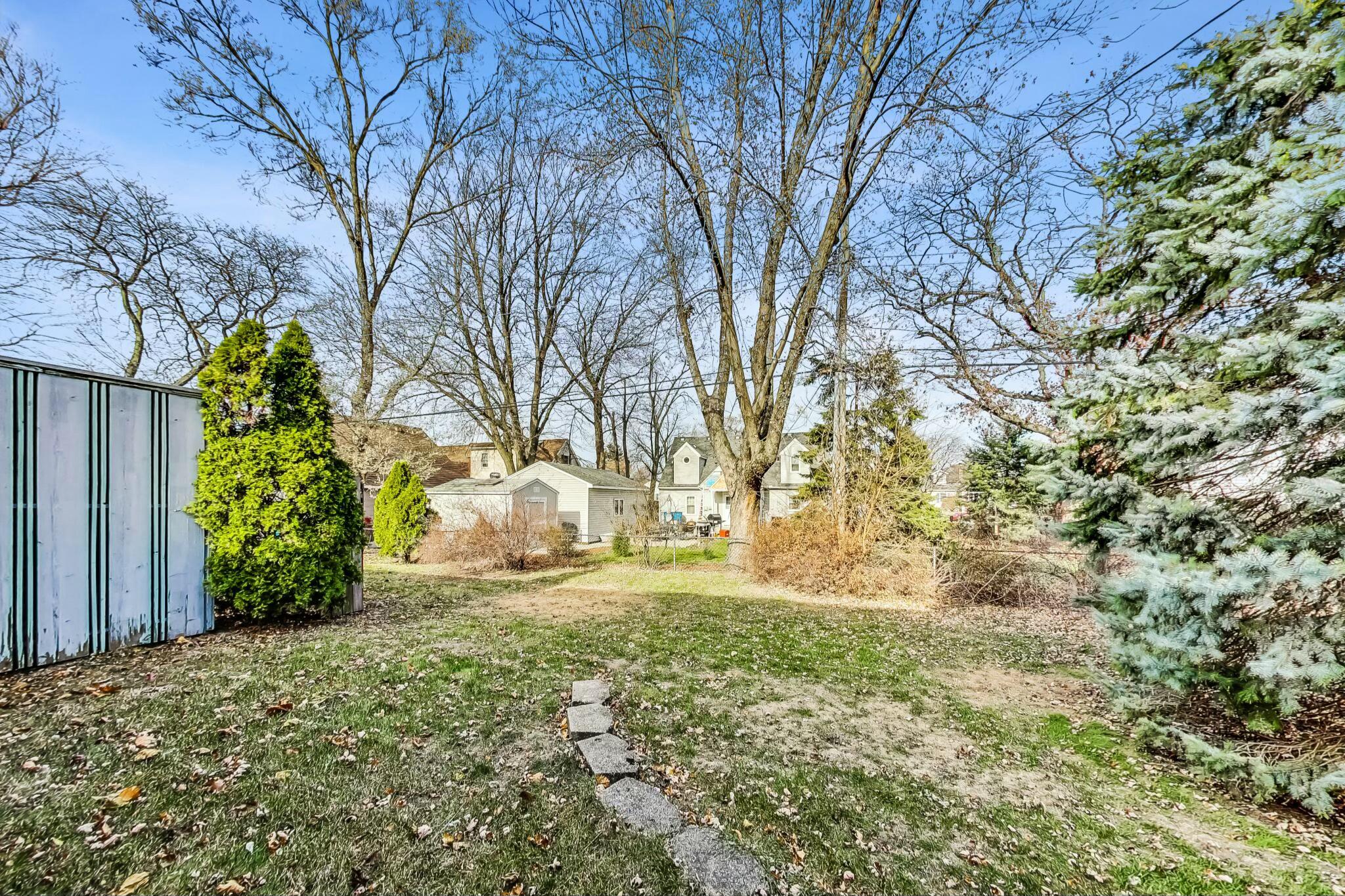 3519 Wicker Avenue Highland, IN 46322 - Photo 49 of 49 a backyard of a house with large trees