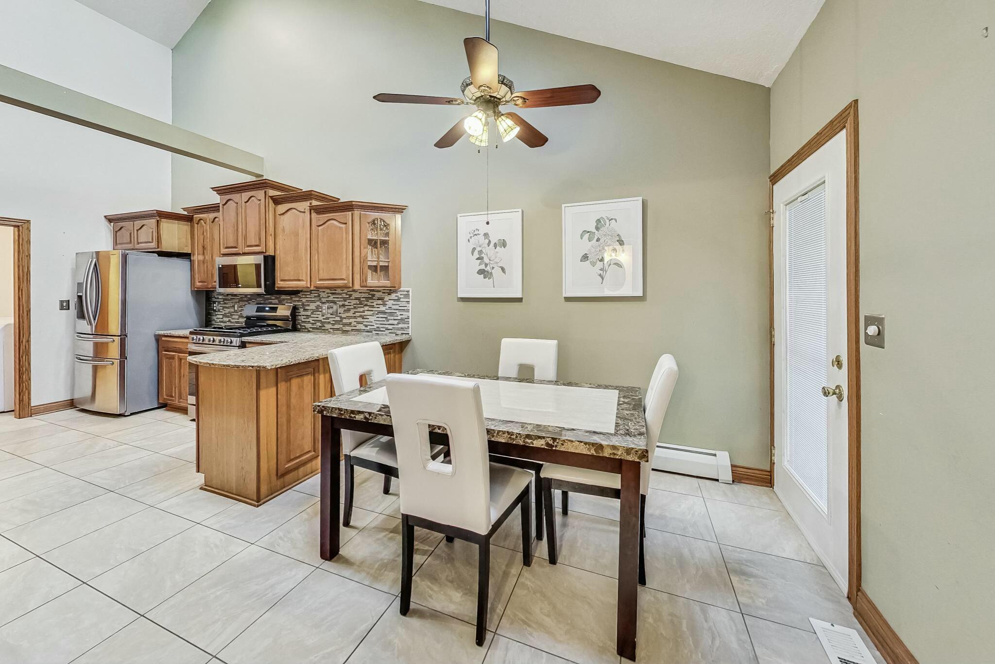 3519 Wicker Avenue Highland, IN 46322 - Photo 9 of 49 a dining room with furniture and a kitchen view