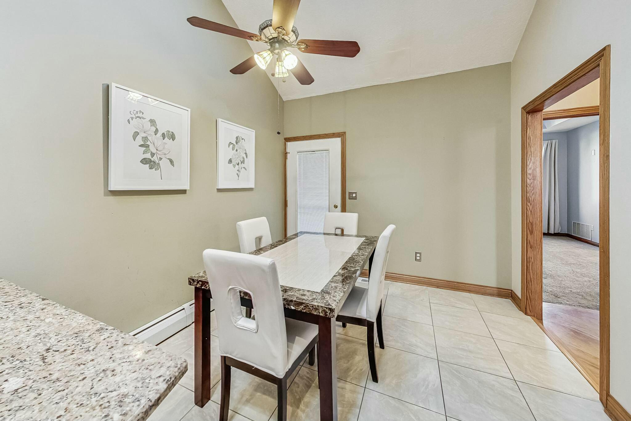 3519 Wicker Avenue Highland, IN 46322 - Photo 10 of 49 a view of a dining room with furniture and a window