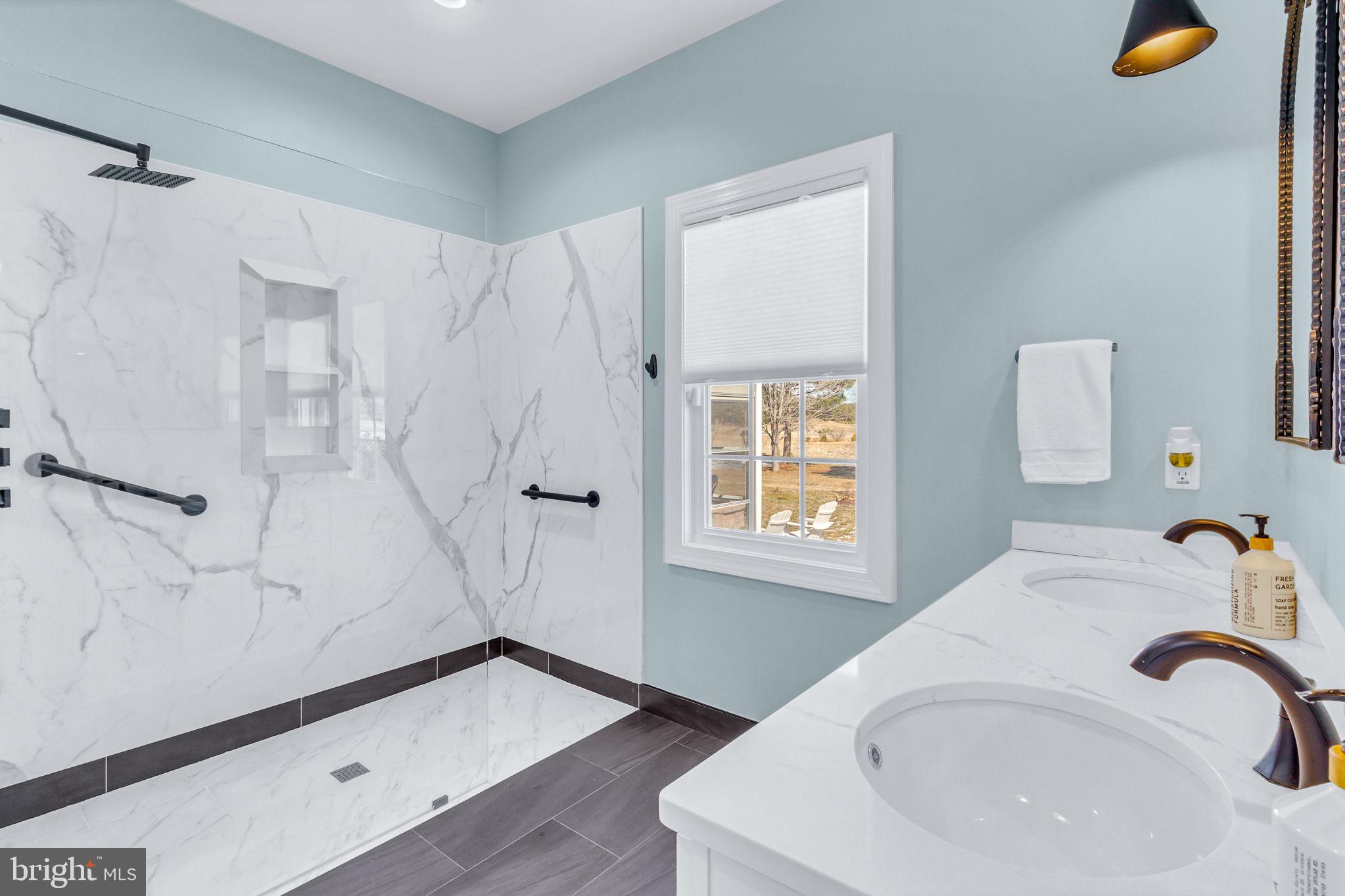 88 Old Field Road Irvington, VA 22480 - Photo 11 of 55 a bathroom with a sink and a mirror