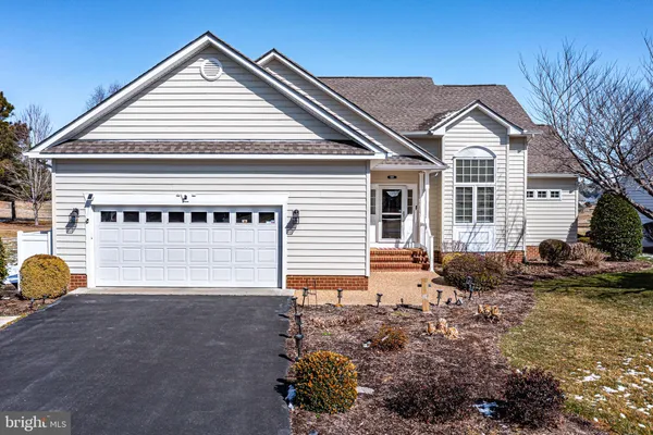 a view of a livingroom with a furniture and front door