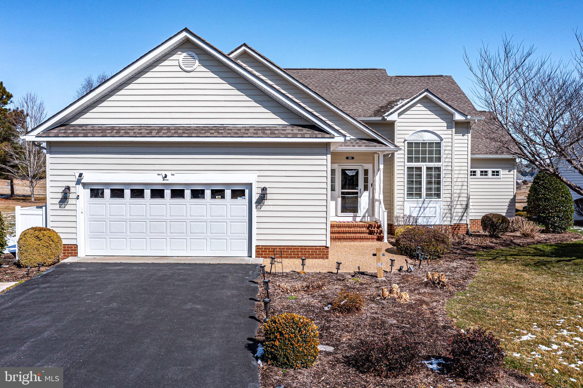 88 Old Field Road Irvington, VA 22480 - Photo 13 of 55 a front view of a house with garden