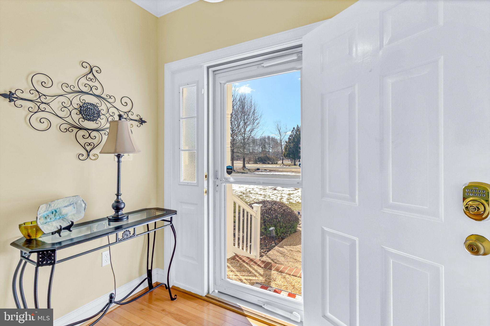 88 Old Field Road Irvington, VA 22480 - Photo 15 of 55 a view of a livingroom with a furniture and front door