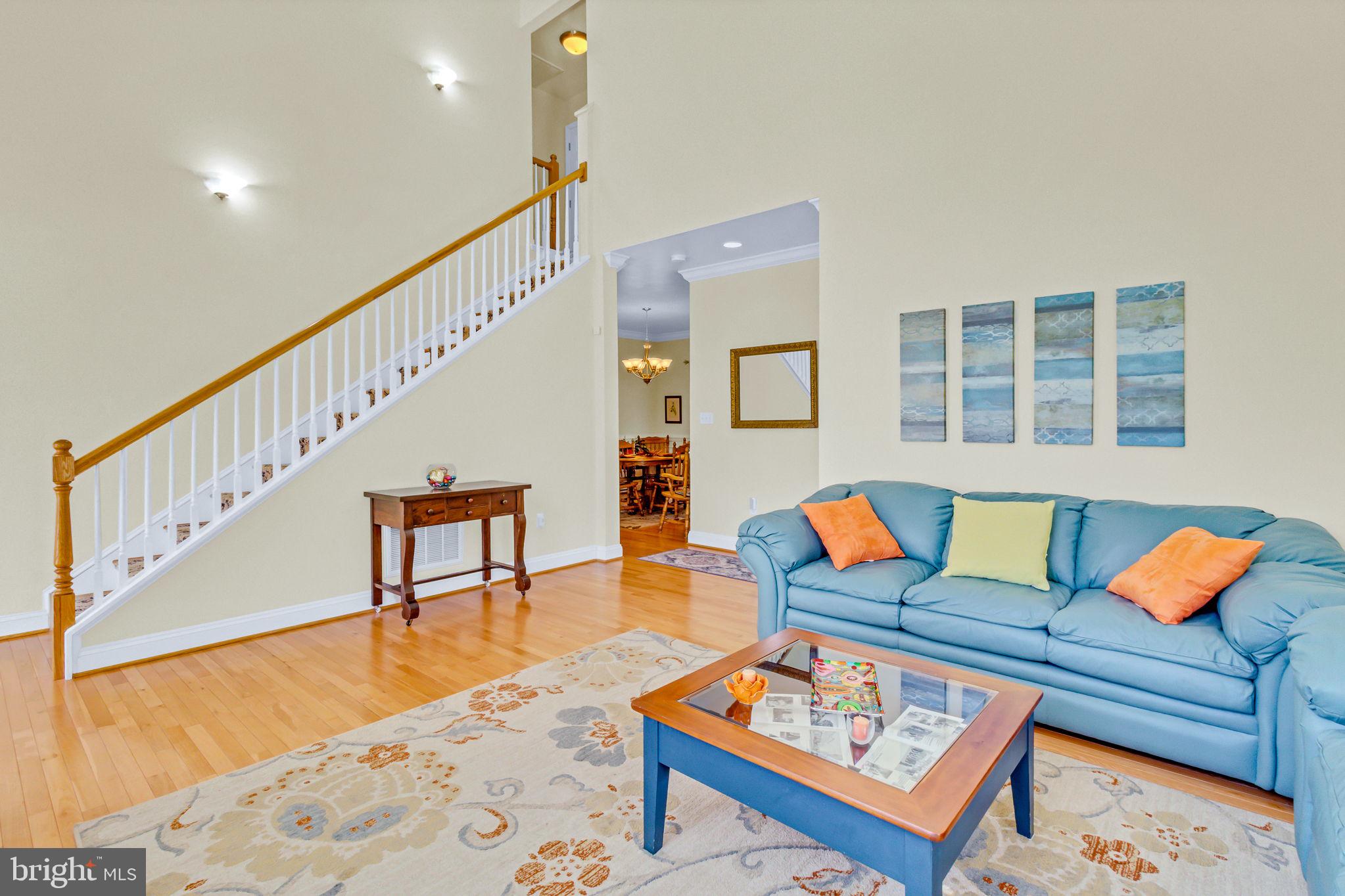 88 Old Field Road Irvington, VA 22480 - Photo 16 of 55 a living room with furniture and wooden floor