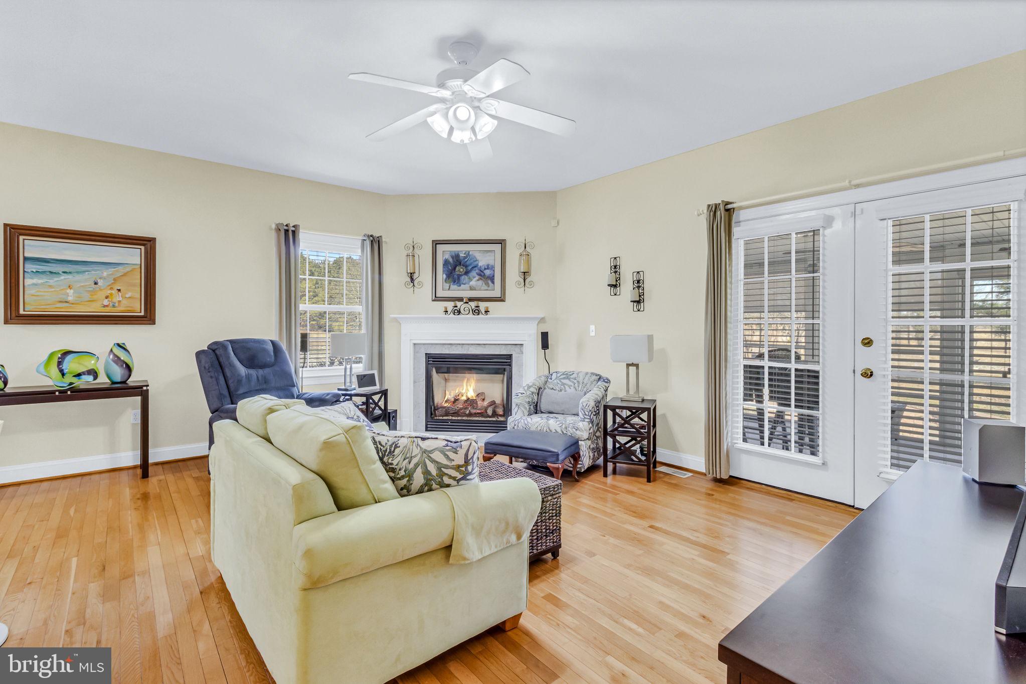 88 Old Field Road Irvington, VA 22480 - Photo 20 of 55 a living room with furniture and a fireplace