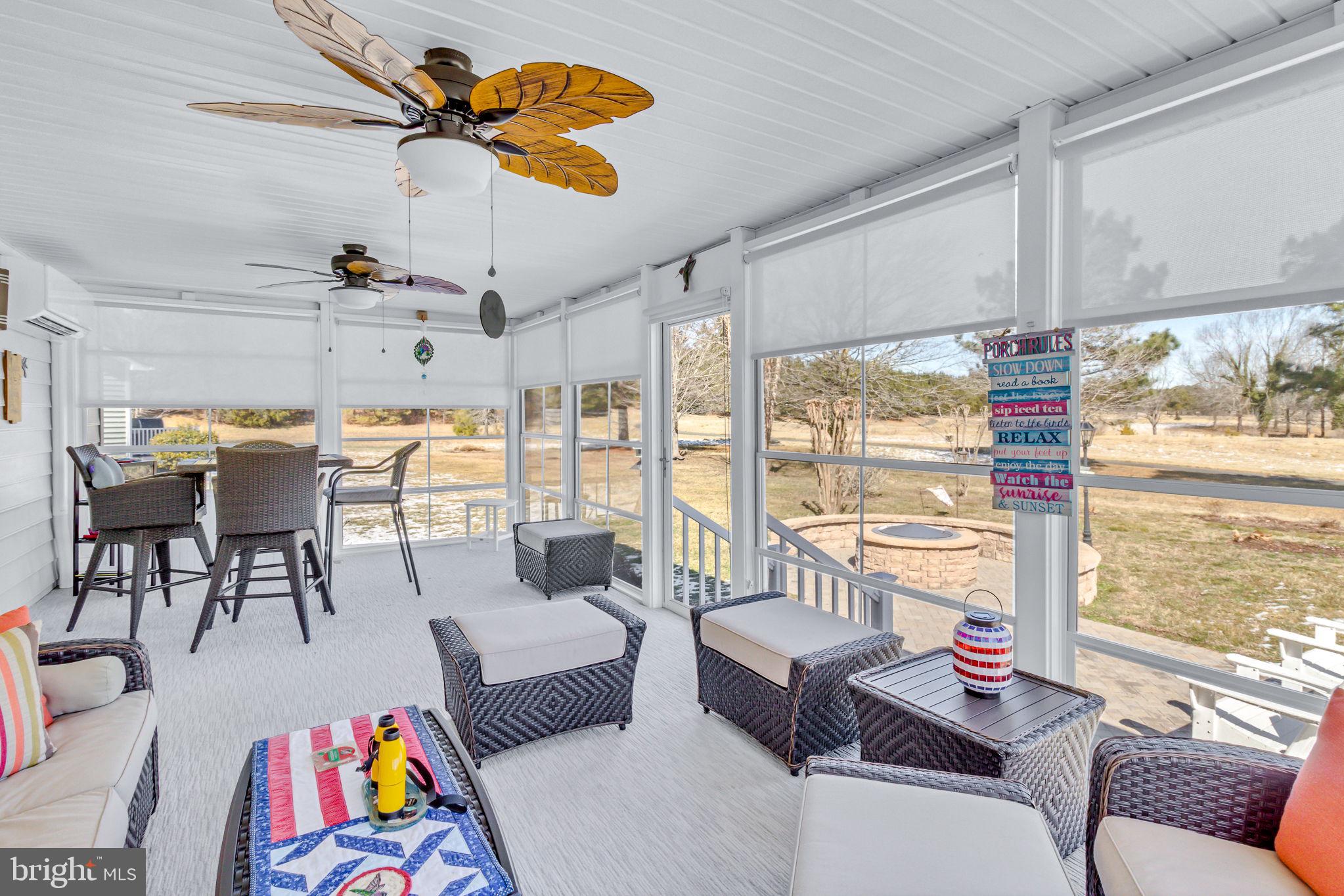 88 Old Field Road Irvington, VA 22480 - Photo 29 of 55 a living room with lots of furniture and a large window