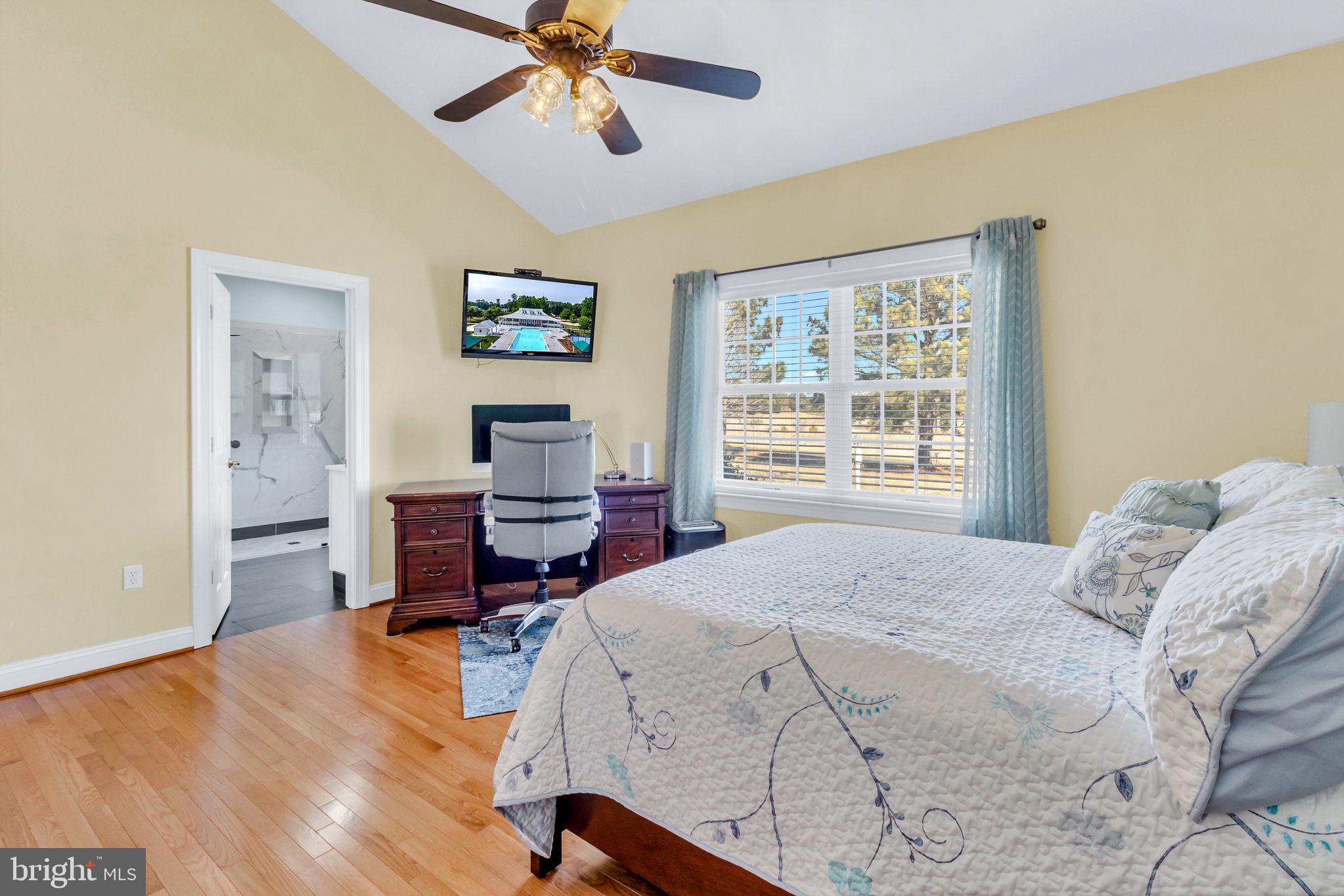 88 Old Field Road Irvington, VA 22480 - Photo 30 of 55 a bedroom with a bed and a window