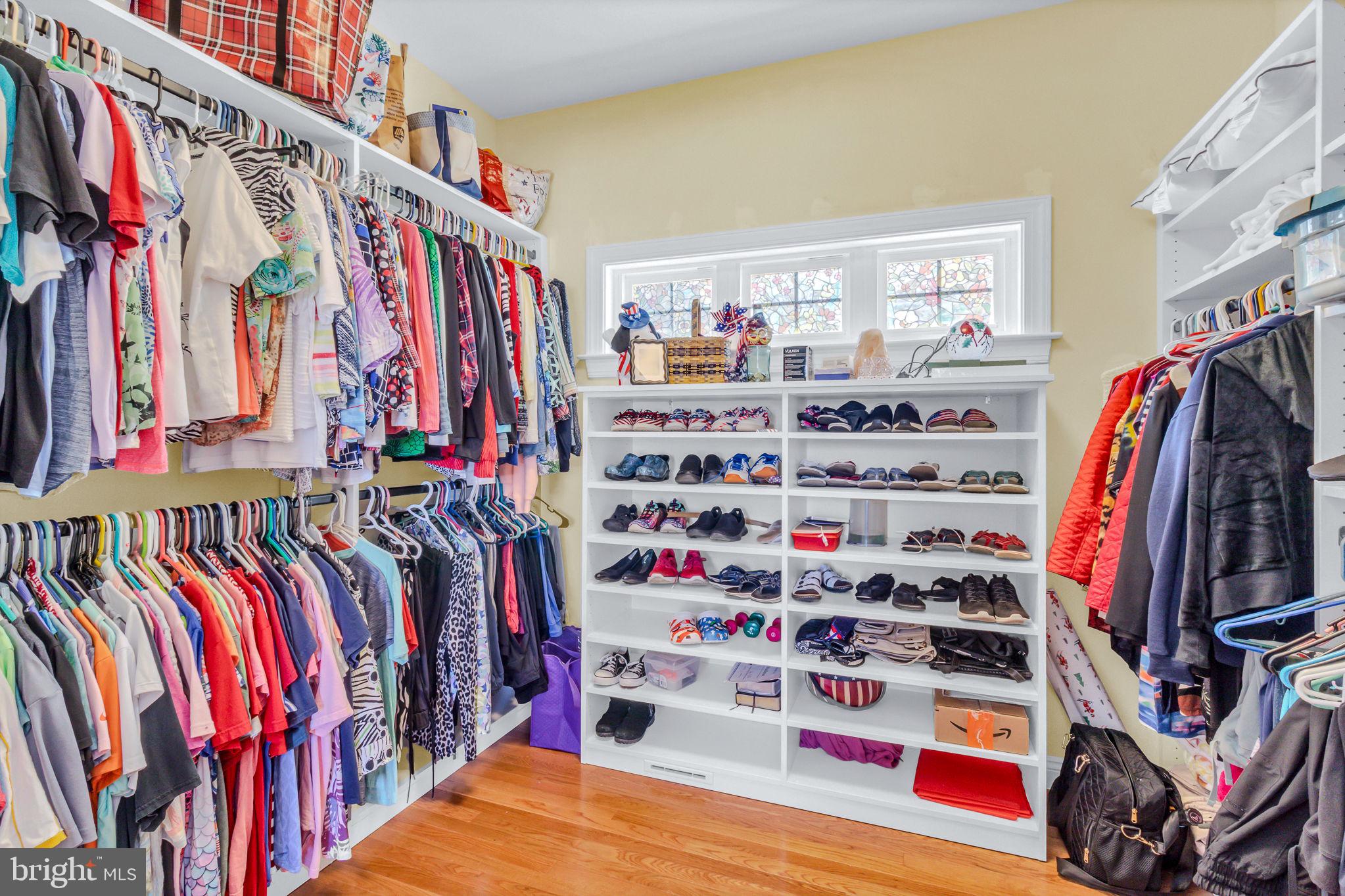 88 Old Field Road Irvington, VA 22480 - Photo 32 of 55 a view of walk in closet with clothes and shoes