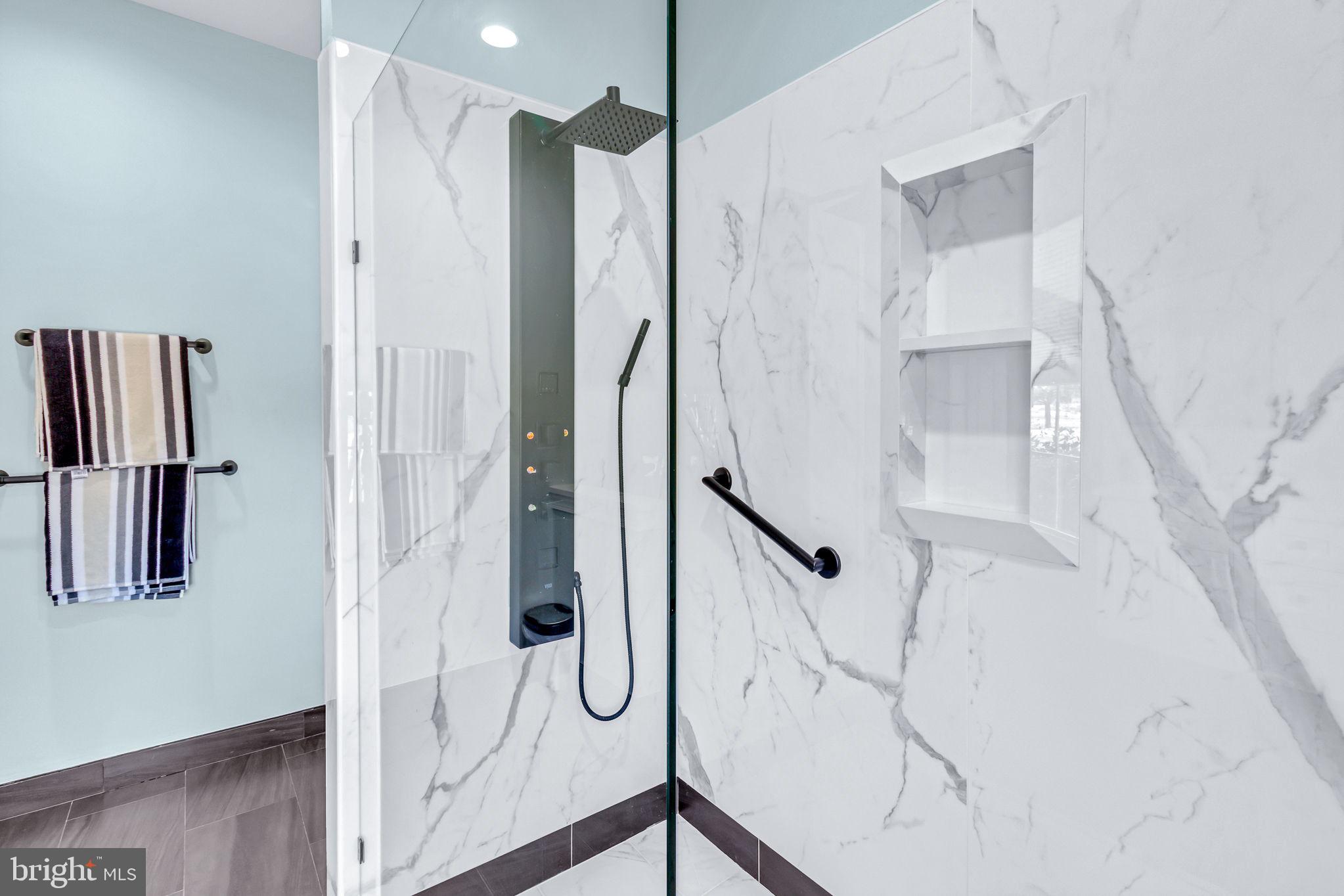 88 Old Field Road Irvington, VA 22480 - Photo 33 of 55 a bathroom with a shower and a glass door