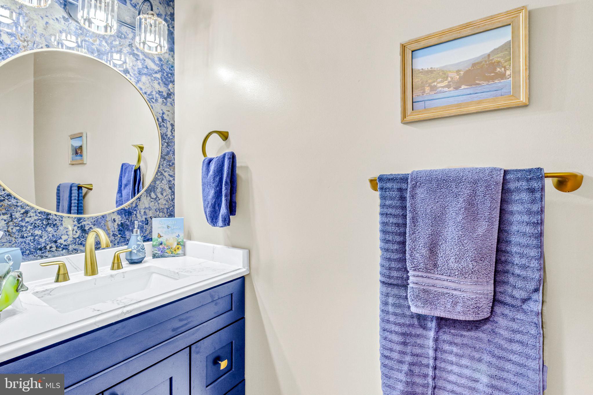 88 Old Field Road Irvington, VA 22480 - Photo 35 of 55 a bathroom with a sink a mirror and vanity