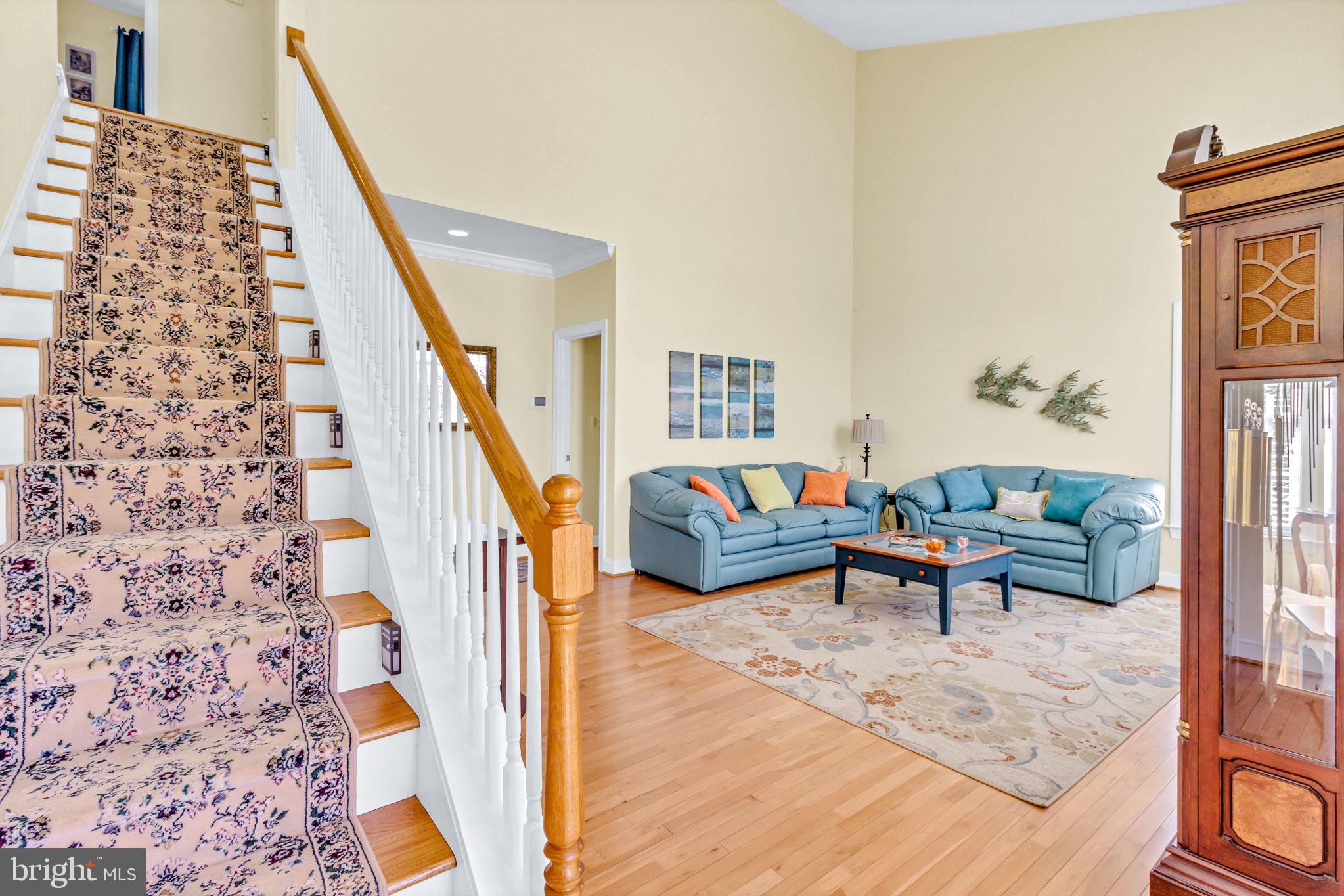 88 Old Field Road Irvington, VA 22480 - Photo 38 of 55 a living room with furniture and stairs