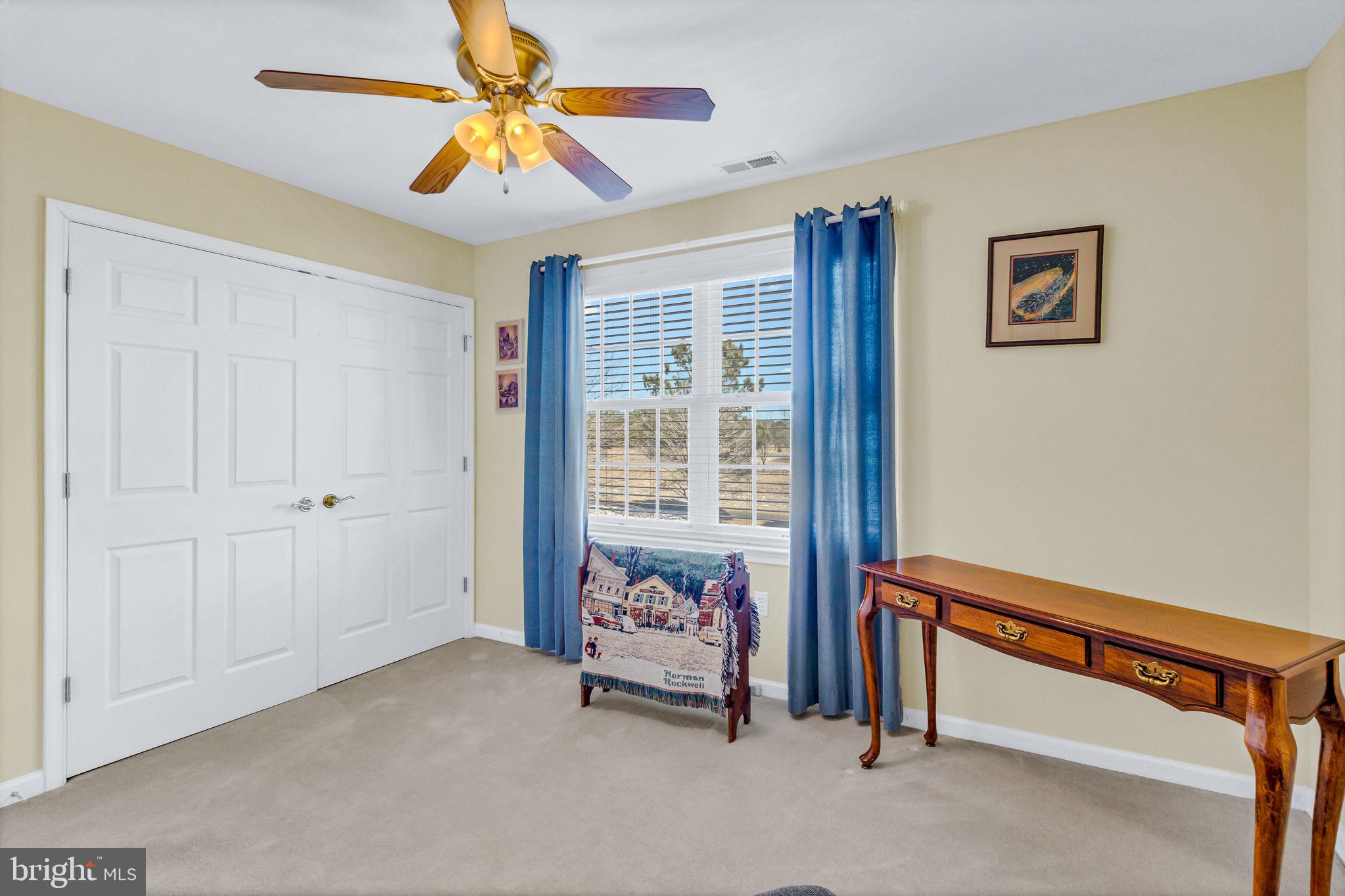 88 Old Field Road Irvington, VA 22480 - Photo 40 of 55 a bedroom with furniture and a window