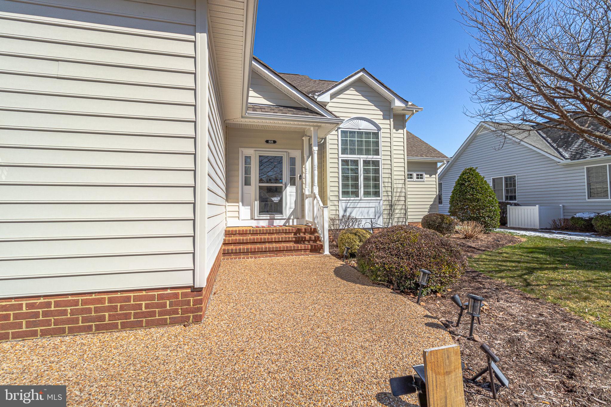 88 Old Field Road Irvington, VA 22480 - Photo 4 of 55 a front view of a house with a yard
