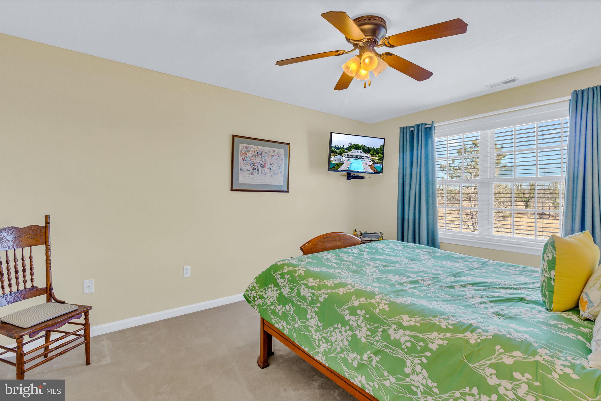 88 Old Field Road Irvington, VA 22480 - Photo 43 of 55 a bedroom with a bed and a window