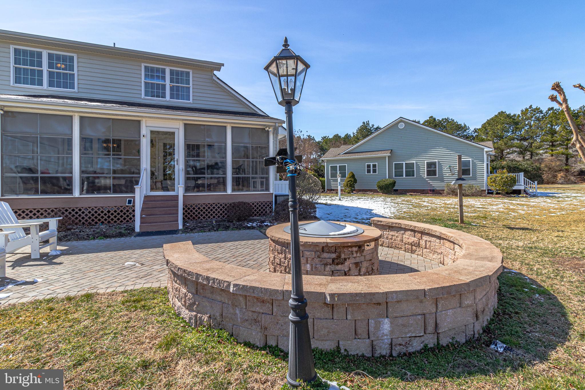 88 Old Field Road Irvington, VA 22480 - Photo 50 of 55 a front view of a house with garden