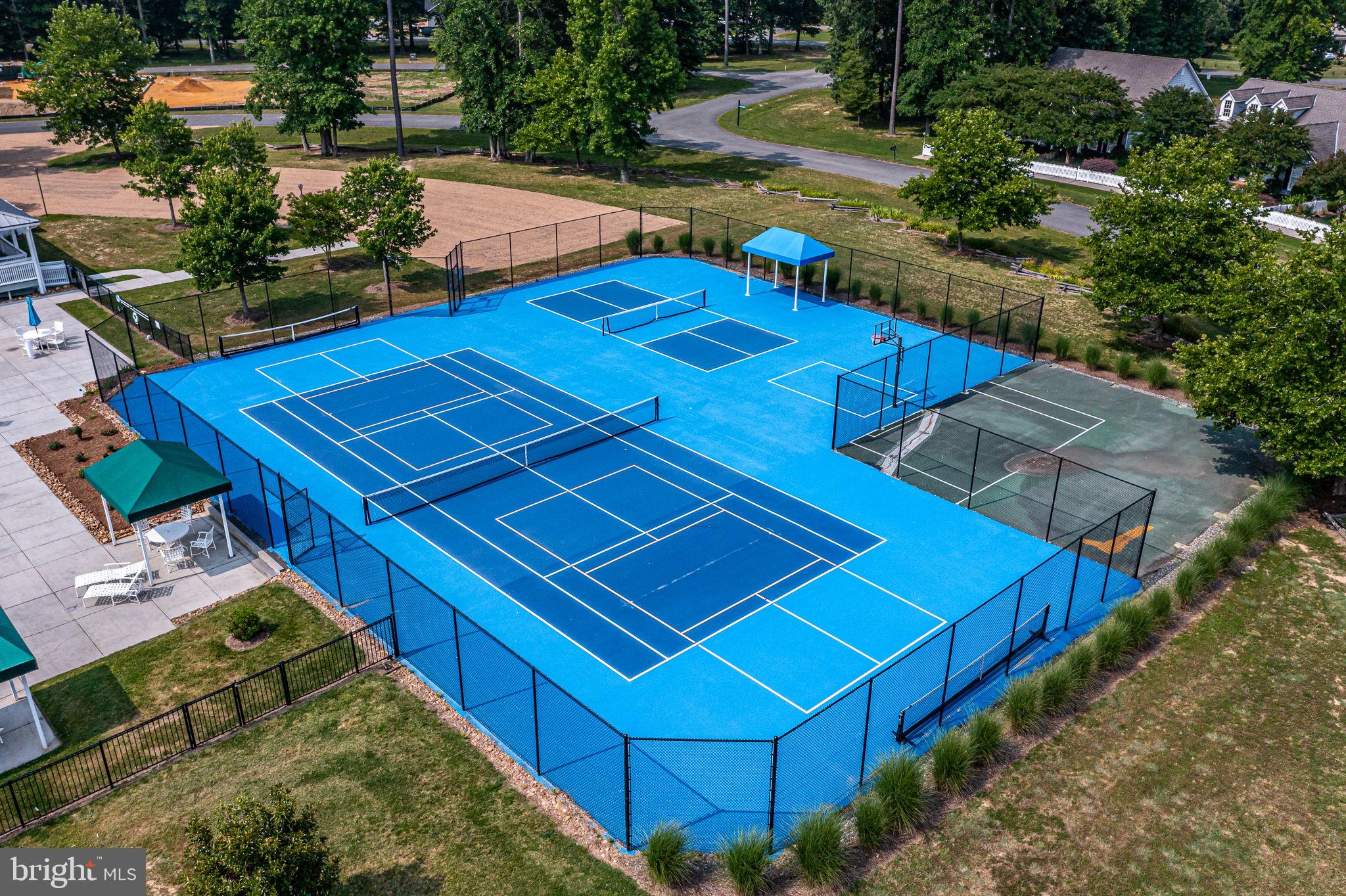 88 Old Field Road Irvington, VA 22480 - Photo 53 of 55 a view of a backyard with chairs and potted plants