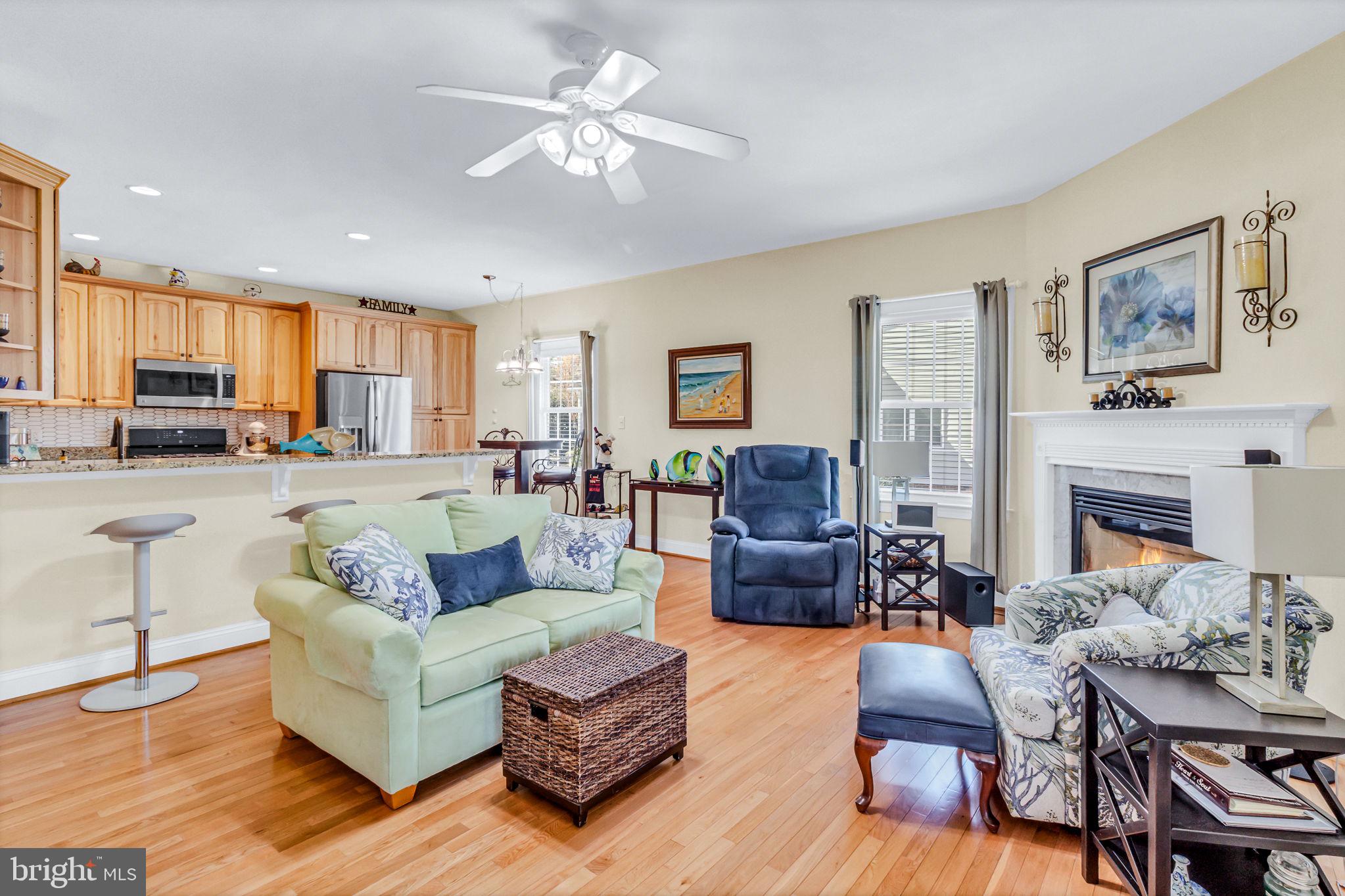 88 Old Field Road Irvington, VA 22480 - Photo 8 of 55 a living room with furniture fireplace and a table